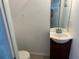 Small half bathroom with toilet and sink at 210 Majors Ln # A, Kissimmee, FL 34743