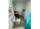Bathroom with toilet, sink, and vanity at 210 Majors Ln # A, Kissimmee, FL 34743