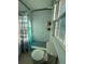 Bathroom with shower, toilet and window at 210 Majors Ln # A, Kissimmee, FL 34743