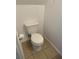 Small bathroom with toilet and tile flooring at 210 Majors Ln # A, Kissimmee, FL 34743