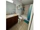 Bathroom with tub, shower, and double vanity at 210 Majors Ln # A, Kissimmee, FL 34743