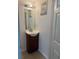 Small bathroom with single vanity and toilet at 210 Majors Ln # A, Kissimmee, FL 34743