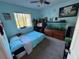 Bedroom with a bed, fish tank and musical keyboard at 210 Majors Ln # A, Kissimmee, FL 34743