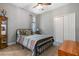 Charming bedroom featuring a metal bed frame and built in closet at 2150 Camden Loop, Davenport, FL 33837