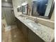 Bathroom with dual vanity and granite countertops at 2213 Rio Pinar Lakes Blvd, Orlando, FL 32822