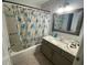Clean bathroom with shower/tub combo, granite vanity, and updated fixtures at 2213 Rio Pinar Lakes Blvd, Orlando, FL 32822