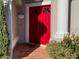 Red double front door with decorative tile entryway at 2213 Rio Pinar Lakes Blvd, Orlando, FL 32822