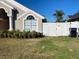 House exterior with well-maintained lawn and white fence at 2213 Rio Pinar Lakes Blvd, Orlando, FL 32822