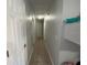 Hallway with multiple doors and tiled floor at 2213 Rio Pinar Lakes Blvd, Orlando, FL 32822