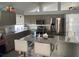 Kitchen with granite countertops, stainless steel appliances, and an island at 2213 Rio Pinar Lakes Blvd, Orlando, FL 32822