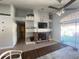 Living room boasts a fireplace, hardwood floors, and access to backyard at 2213 Rio Pinar Lakes Blvd, Orlando, FL 32822
