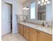 Double vanity bathroom with granite countertop and tiled floor at 249 Treviso Dr, Kissimmee, FL 34759