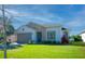 Single story house with gray garage door and lush landscaping at 249 Treviso Dr, Kissimmee, FL 34759