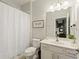 Clean bathroom with a shower/tub combo, vanity, and toilet at 4449 Shiva Loop, Kissimmee, FL 34746
