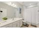 Clean bathroom with a tub shower, vanity, and toilet at 4449 Shiva Loop, Kissimmee, FL 34746