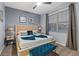 Spacious bedroom with king-size bed and large window at 4449 Shiva Loop, Kissimmee, FL 34746