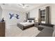 Main bedroom with king bed and sitting area at 4449 Shiva Loop, Kissimmee, FL 34746