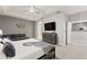 Spacious bedroom with a king-size bed and a sitting area at 4449 Shiva Loop, Kissimmee, FL 34746