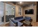 Covered patio with sectional sofa and flat-screen TV, near the pool at 4449 Shiva Loop, Kissimmee, FL 34746