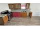 Close-up of the kitchen countertops, cabinets, and stainless steel appliances at 512 Bennett St, Auburndale, FL 33823