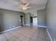 Bright and spacious living room with tile flooring and ceiling fan at 802 Toledo Ct, Kissimmee, FL 34758