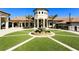 Elegant community center with a central fountain and landscaping at 8932 Cabot Cliffs Dr, Davenport, FL 33896