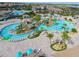 Resort-style pool with lazy river and water features at 8932 Cabot Cliffs Dr, Davenport, FL 33896