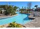 Relaxing lazy river with lush landscaping and palm trees at 8932 Cabot Cliffs Dr, Davenport, FL 33896