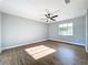 Bright bedroom with hardwood floors and ceiling fan at 905 W 11Th Ave, Mount Dora, FL 32757