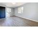 Bedroom with large window and wood-look floors at 905 W 11Th Ave, Mount Dora, FL 32757