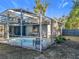 Screened pool and patio area with a view of the backyard at 905 W 11Th Ave, Mount Dora, FL 32757