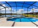 Inviting pool and spa with lake view at 1016 Tourmaline Dr, Kissimmee, FL 34746