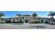 Community clubhouse with palm trees and ample parking at 1181 Trappers Trail Loop, Davenport, FL 33896