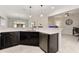 Spacious kitchen island with white quartz countertops and dark cabinetry at 1181 Trappers Trail Loop, Davenport, FL 33896