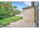 Spacious backyard with paver patio and lush landscaping at 1233 Aquila Loop, Celebration, FL 34747