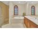 Spa-like bathroom with soaking tub, shower, and double vanity at 1233 Aquila Loop, Celebration, FL 34747