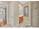 Bathroom with shower, vanity, and access to other rooms at 1233 Aquila Loop, Celebration, FL 34747