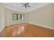 Spacious bedroom with wood floors and large window at 1233 Aquila Loop, Celebration, FL 34747