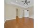 Bright bedroom featuring hardwood floors and access to bathroom at 1233 Aquila Loop, Celebration, FL 34747