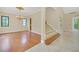 Formal dining room with hardwood floors, chandelier, and large windows at 1233 Aquila Loop, Celebration, FL 34747