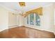 Spacious dining room with hardwood floors and elegant chandelier at 1233 Aquila Loop, Celebration, FL 34747