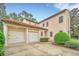 Two-car garage with white doors and columns at 1233 Aquila Loop, Celebration, FL 34747