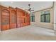 Gathering room featuring built-in wooden shelving and a ceiling fan at 1233 Aquila Loop, Celebration, FL 34747