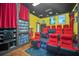 Home theater with red seating and a large movie screen at 1233 Aquila Loop, Celebration, FL 34747