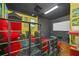 Home theater with red seating, projector, and popcorn machine at 1233 Aquila Loop, Celebration, FL 34747
