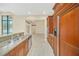 Kitchen boasts granite countertops, stainless steel appliances, and ample wood cabinets at 1233 Aquila Loop, Celebration, FL 34747