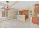 Kitchen with island, hardwood cabinets and tile floor at 1233 Aquila Loop, Celebration, FL 34747