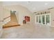 Open living room featuring a staircase and high ceilings at 1233 Aquila Loop, Celebration, FL 34747