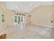 Large living room with tile floors and access to backyard at 1233 Aquila Loop, Celebration, FL 34747