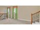 Bright loft with carpeted floors and green curtains at 1233 Aquila Loop, Celebration, FL 34747